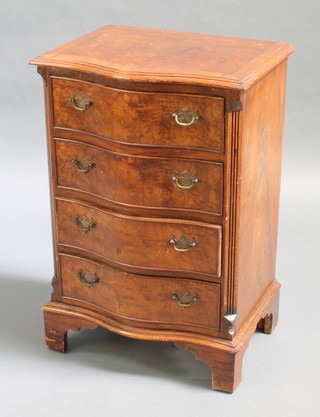 A Georgian style mahogany chest of serpentine outline with crossbanded top, fitted 4 long drawers with fluted columns to the sides 30" x 20" x 15 1/2" 
