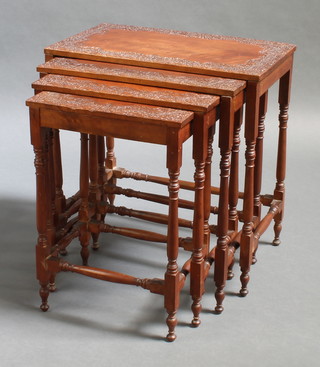 A  quartetto of rectangular Burmese carved hardwood interfitting coffee tables raised on turned and block supports 23" x 22" x 13", 22" x 19 1/2" x 11 1/2", 21 1/2" x 17" x 10 1/2", 21" x 14 1/2" x 10" 
