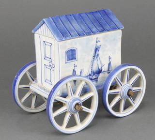 A Delft box in the form of a wagon 6 1/2" and a Nao hound 6"