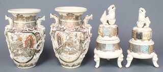A pair of 20th Century Satsuma hexagonal vases decorated with figures on raised stands with high domed lids and Shi Shi finials 14" 