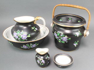 An Edwardian Cauldon Ltd black ground floral decorated washstand set comprising jug, bowl, soap dish, slop pail and vase