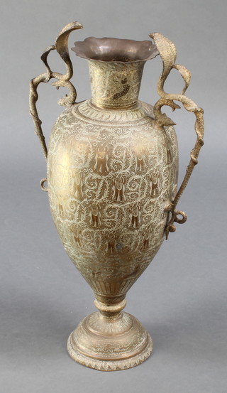 A Benares brass twin handled urn with cobra handles 29" 