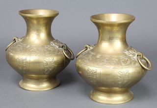 A pair of Japanese gilt bronze twin handled vases of club form raised on spreading feet 9"h x 8" diam. 
