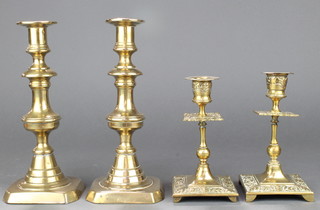 A pair of 19th Century brass candlesticks with ejectors 9" and a pair of Victorian brass candlesticks 7" 