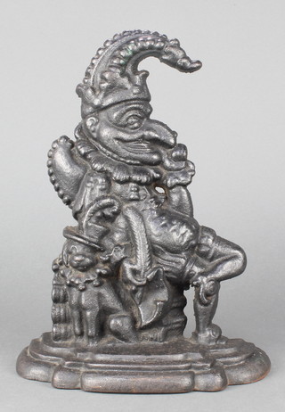 A Victorian cast iron door stop in the form of a seated Mr Punch 11" 