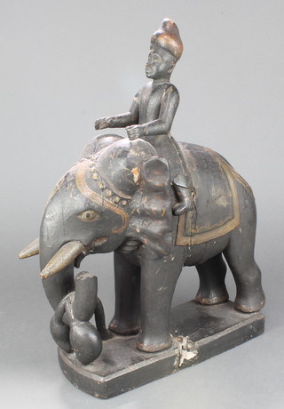 A 19th/20th Century Indian carved wooden and painted figure of an elephant 17" x 11" x 5"