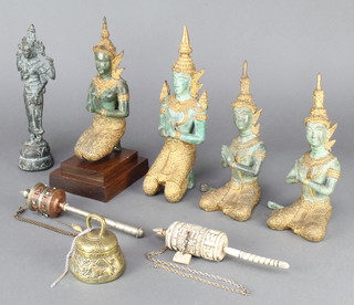 4 Burmese gilt bronze figures of kneeling deities 10", 9",  8" and 8", a bronze figure of a standing deity 9 1/2", 2 reproduction Tibetan prayer reels and a brass bell with signs of the Zodiac 3"