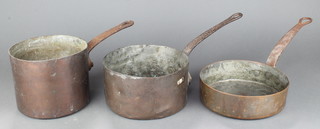 A copper saucepan marked 2PH with iron handle 5" x 7", 1 other 4" x 8" and a copper frying pan 2 1/2" x 8" 