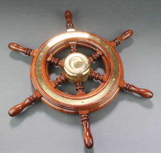A teak and gilt metal 6 spoked ships wheel 19 1/2" diam.