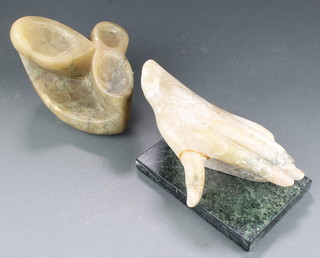 A carved marble sculpture in the form of a hand raised on a rectangular base (thumb F and R) 5" x 10" x 7" and a marble sculpture in the form of a stylised leaf 4" x 8" x 6" 