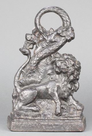 A Victorian cast iron door stop decorated a lion 12" x 7 1/2" 