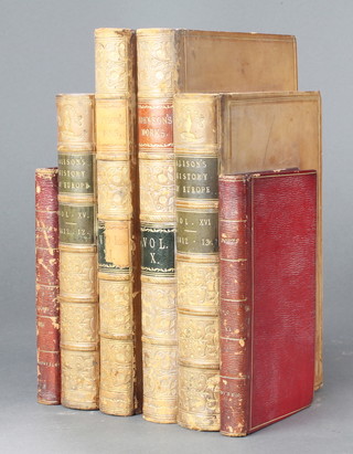 A pair of book ends formed from 6 graduated leather bound books 