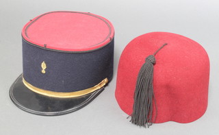 A French Kepi together with a Fez cap 