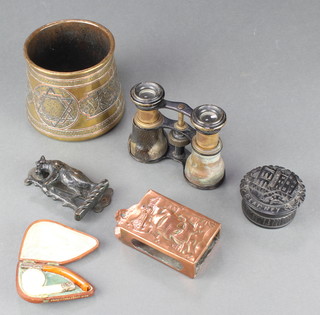 A Newlyn style embossed copper match slip decorated a galleon 1" x 4" x 2", a bog oak jar and cover marked Blainey 1 1/2" x 2", a brass jar 3 1/2", a pair of opera glasses etc 