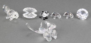 A Swarovski crystal figure of a panda cub 1", 2 ditto turtles 1", a beaver 1 1/2", a paperweight 1", a clam shell 1" and a flower 2" 