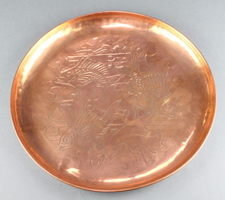 A circular Newlyn copper tray decorated carp, marked Newlyn 13" 