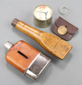 A wooden wedge shaped plumbing tool marked Monument Tools London, a miniature hip flask, a jar and cover decorated birds 