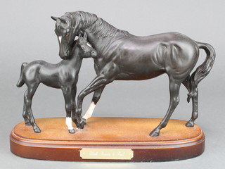 A Royal Doulton matt black group - Black Beauty and Foal on a wooden socle 13" 