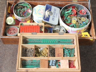 A Shortex wooden box containing various pieces of red and green Meccano together with a mahogany box with hinged lid containing Meccano 