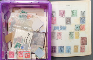 An Atlas album of used World stamps and a quantity of loose stamps
