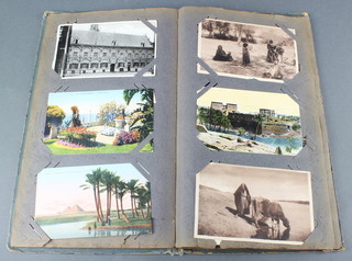 An album of coloured and black and white postcards 