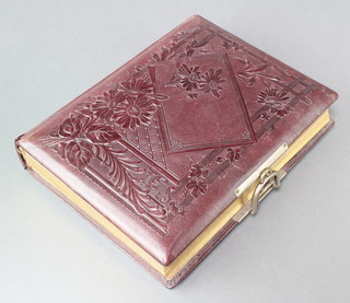 A Victorian red leather bound photograph album 
