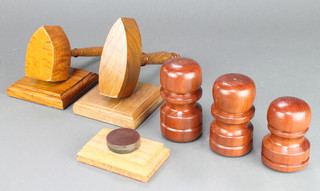2 wooden wedge shaped gavels and sounding blocks together with 3 turned wooden gavels and a sounding block