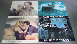 12 coloured lobby cards for "Raise The Titanic" 11" x 14" and 8 ditto "Bad Timing" 11" x 14" 