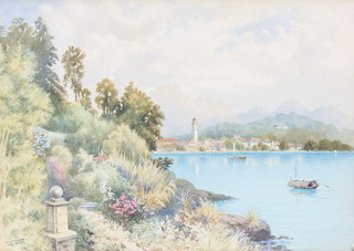 T A M '04, watercolour, monogrammed and dated, Continental lakeside view with buildings 10" x 14" 