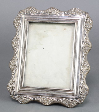 An Edwardian repousse silver photograph frame Sheffield 1902 8" x 6 1/2" 