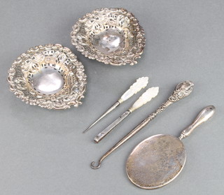 A pair of Victorian repousse and pierced silver heart shaped bon bon dishes Chester 1895 3 1/2", a mirror and 3 implements 