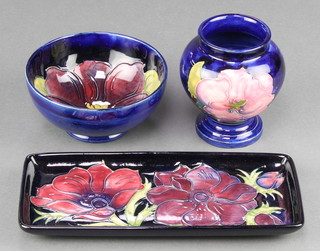 A modern Moorcroft rounded rectangular dish decorated with clematis 8", a ditto baluster vase 3 1/2" and a similar bowl 4" 