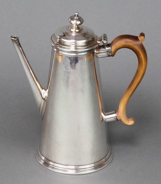 A Georgian silver tapered coffee pot with fruitwood handle, rubbed marks 9 1/2", gross weight 740 grams 