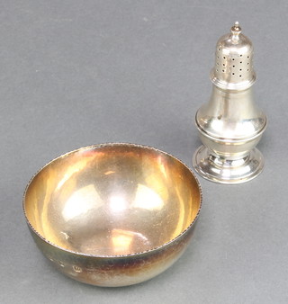 A silver hammered pattern bowl London 1996 3 1/2" and a silver shaker Chester 1919, 145 grams