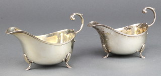 A pair of silver sauce boats with S scroll handles and hoof feet, Birmingham 1942, 224 grams 