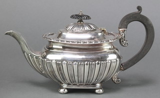 A Victorian silver batchelor's teapot with egg and dart and demi-fluted decoration having ebony mounts on ball feet. Birmingham 1896, gross weight 346 grams 
