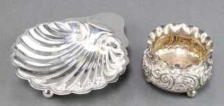 An Edwardian silver shell shaped butter dish Sheffield 1908 and a Victorian  repousse silver salt Sheffield 1898 62 grams  