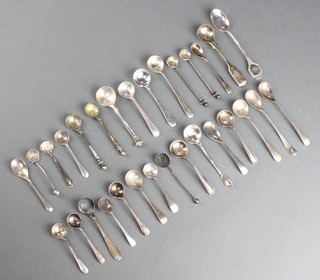 A collection of silver salt and mustard spoons, 160 grams 