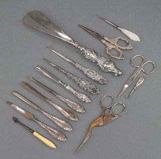 An Edwardian silver handled shoe horn and minor silver handled implements 