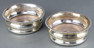 A pair of George IV silver coasters with gadrooned rims London 1827, maker Adey Bellamy Savory 5 1/2" 