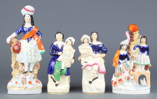 A  Staffordshire figure of highland lady 10", ditto spill vase of a highland couple 8 1/2" and a pair of figures with children 7" 