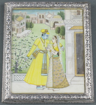 An Indian silver cigarette box the painted ivory lid with a couple on a pavilion terrace the box is decorated with flowers 4 1/4" x 3 3/4", 208 grams 