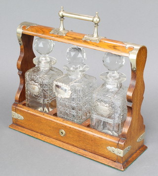 An Edwardian silver plated mounted 3 bottle tantalus 14" 