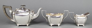 A silver 3 piece tea set of octagonal baluster form with ebony handles Birmingham 1945/1949,  maker Daniell & Arter, gross weight 40 ozs 