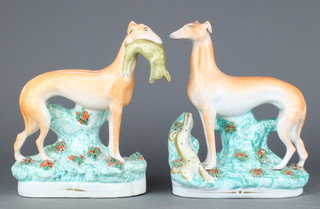 A pair of Victorian Staffordshire figures of greyhounds and hares 11" 