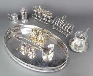 A silver plated galleried oval tray 19", a plated egg cup set and minor plated items 