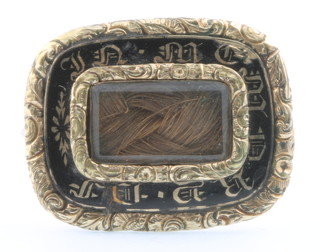 An early 19th Century gilt enamelled mourning brooch inscribed Charles Tadma? Obt 27th Jany 183? Aged 37 Years
