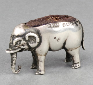 An Edwardian novelty silver pin cushion in the form of a standing elephant, Birmingham 1908, maker Adie & Lovekin Ltd 1 1/2" 