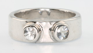 A 9ct white gold wide band paste set ring, size K 1/2