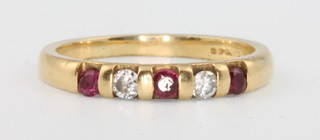 An 18ct yellow gold ruby and diamond ring size J 